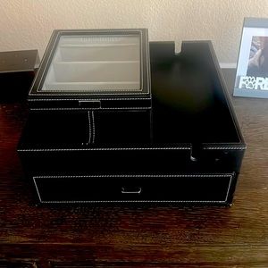 Sunglasses and/or jewelry organize.slot for phone charger.Very multipurpose!